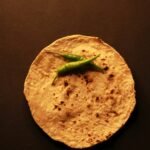 Corn tortilla with peppers on it.