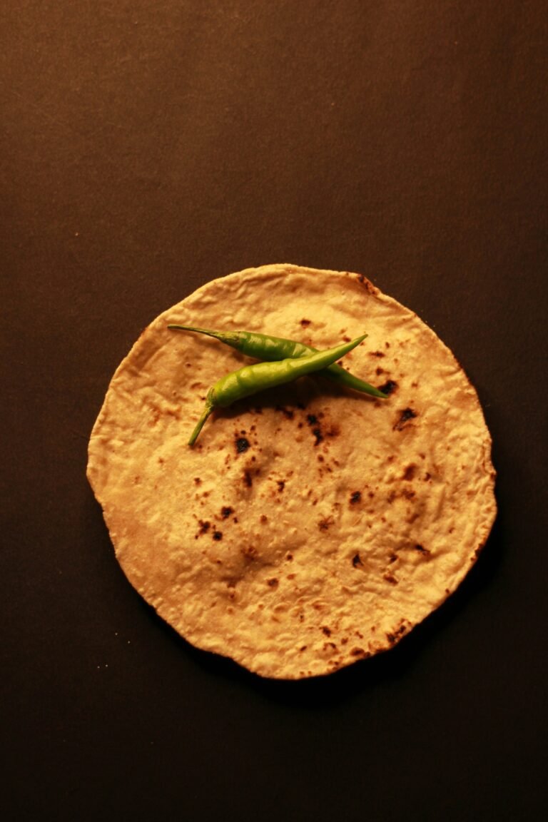 Corn tortilla with peppers on it.